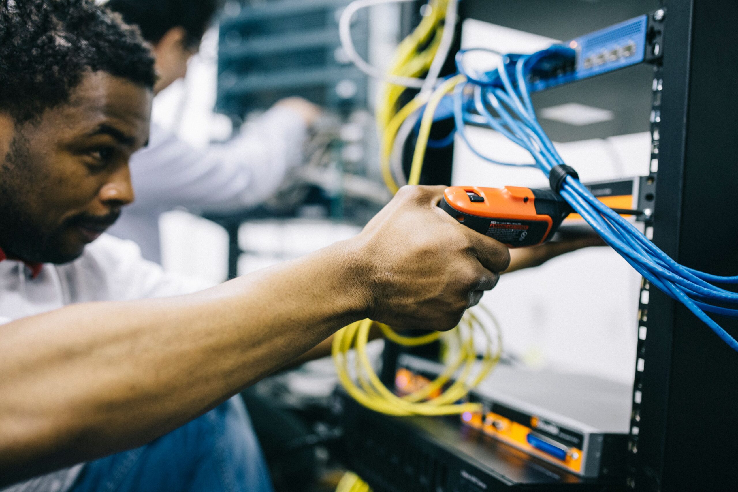 African engineer performing computer and website maintenance work