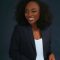 African woman blue blazer Elegant African woman in a blue blazer smiling