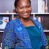 African woman blue outfit Smiling African businesswoman in a colorful blue outfit